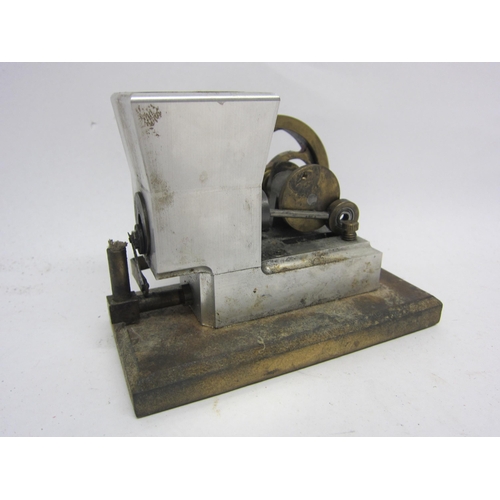 9544 - A small hot air stationary engine with single cylinder and polished brass flywheel on wooden base, 9... 