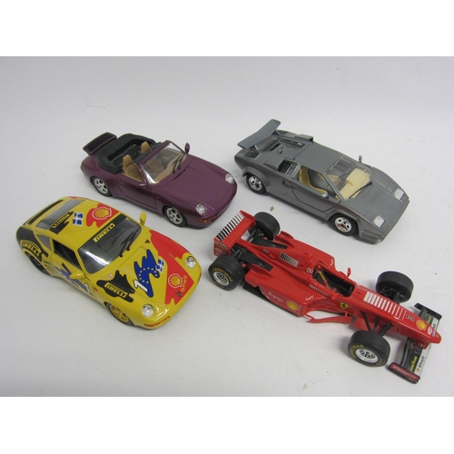 9245 - Four Burago 1:24 scale diecast cars