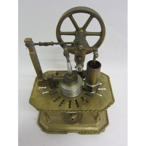 9537 - A Stirling hot air stationary engine with 8.5cm diameter flywheel, on ornate brass two tier frame wi... 