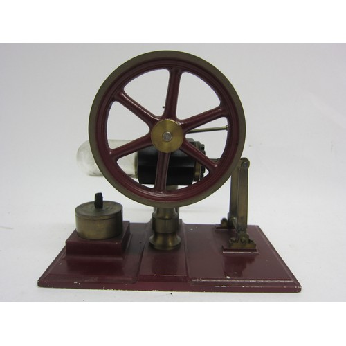 9545 - A Stirling hot air stationary engine with 9cm diameter flywheel, on heavy cast metal base, 15cm tall