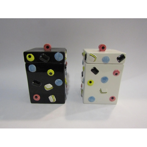 4388 - Two Liquorice Allsorts canisters, one white, one black