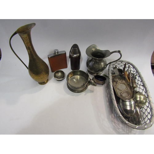 4409 - A selection of plated ware and brass to include two hip flasks, a coaster and a pewter wine jug with... 