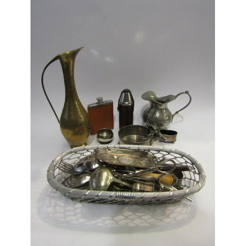 4409 - A selection of plated ware and brass to include two hip flasks, a coaster and a pewter wine jug with... 