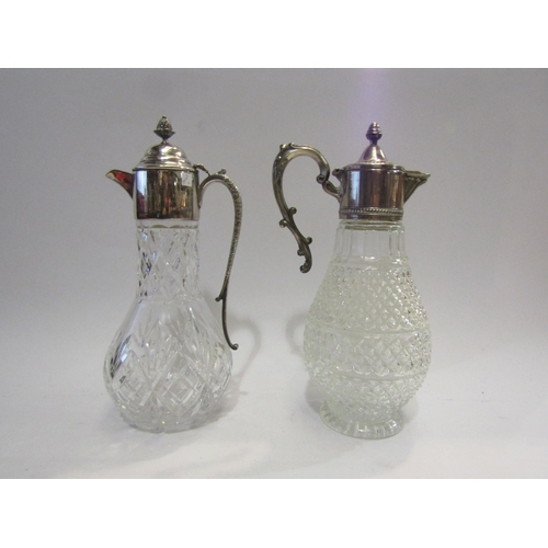 4446 - A plated and cut glass claret jug presented to 