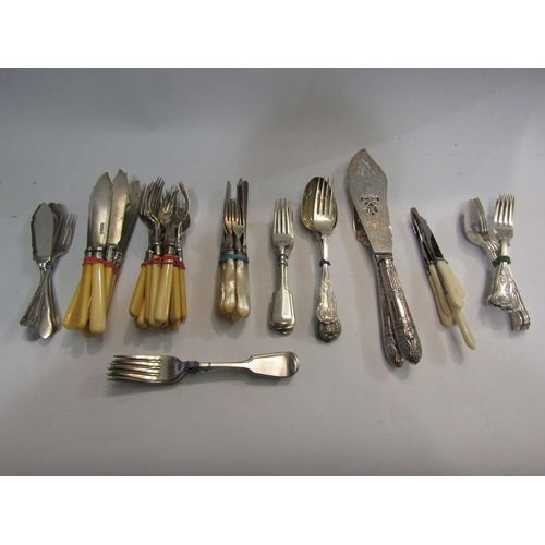 4447 - A quantity of miscellaneous plated flatware to include servers, fish knives and forks, butter knives... 