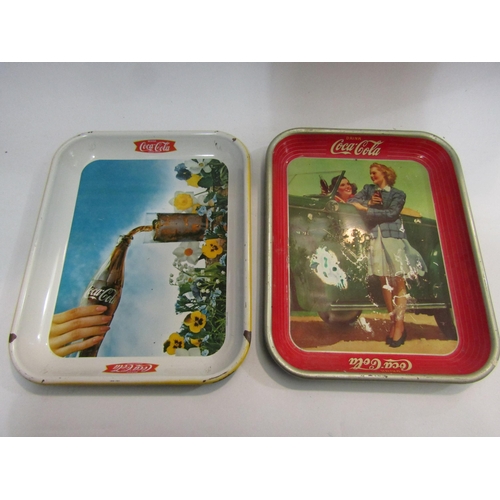 4450 - Five vintage Coca-Cola trays, some a/f to include ice skater, a woman dressed in early 20th Century ... 