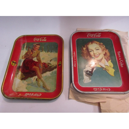 4450 - Five vintage Coca-Cola trays, some a/f to include ice skater, a woman dressed in early 20th Century ... 