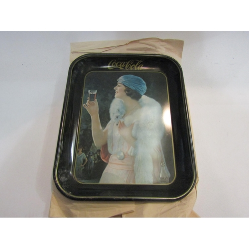 4450 - Five vintage Coca-Cola trays, some a/f to include ice skater, a woman dressed in early 20th Century ... 