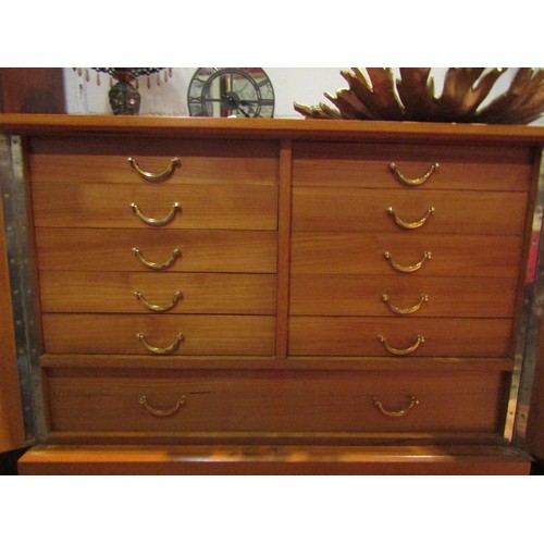 1045 - A Swedish teak two door cabinet with working key opening to reveal a bank of ten short and one long ... 