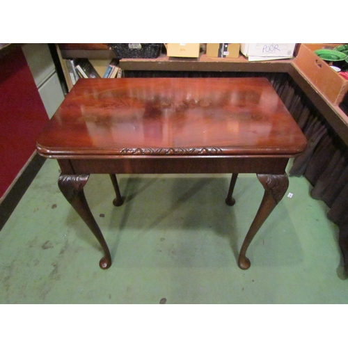 4002 - A George III style flame mahogany card/games table, the hinged fold-over felt top over acanthus leaf... 