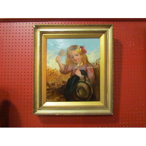 4034 - A Victorian oil on canvas, young girl holding a crow scarer aloft sitting in corn field, gilded fram... 