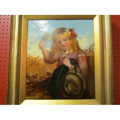 4034 - A Victorian oil on canvas, young girl holding a crow scarer aloft sitting in corn field, gilded fram... 