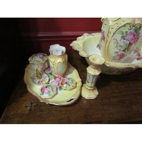 4038 - A blush wash set consisting of jug, wash bowl, dressing table set, etc., rose design, some pieces a/... 