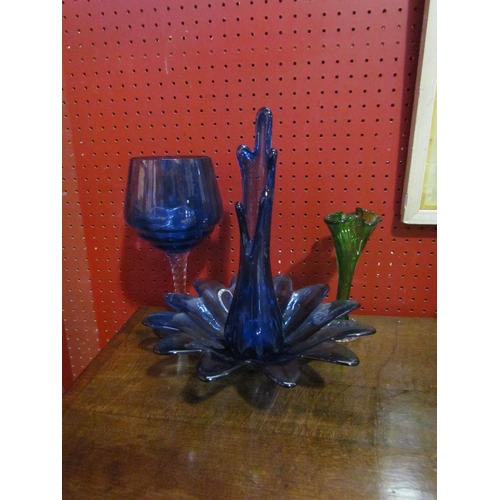 4053 - Four pieces of coloured glass including blue splash style vase, green and clear glass stem vase etc.