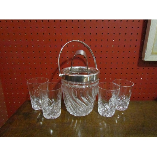 4058 - A set of four crystal whisky tumblers together with a small ice bucket and tongs