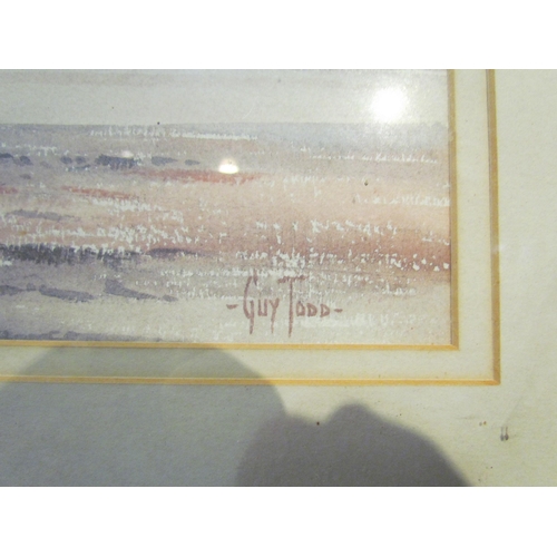 4070 - GUY TODD (1925-2003): A framed and glazed watercolour of moored boats on still waters, signed bottom... 