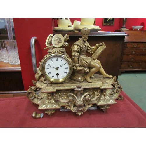 4092 - A gilt mantel clock surmounted by a 16th Century artist, one leg a/f, with key and pendulum