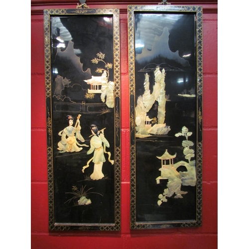 4112 - A pair of rectangular lacquered wall plaques, shell form depicting Oriental figures and pagodas, 91c... 