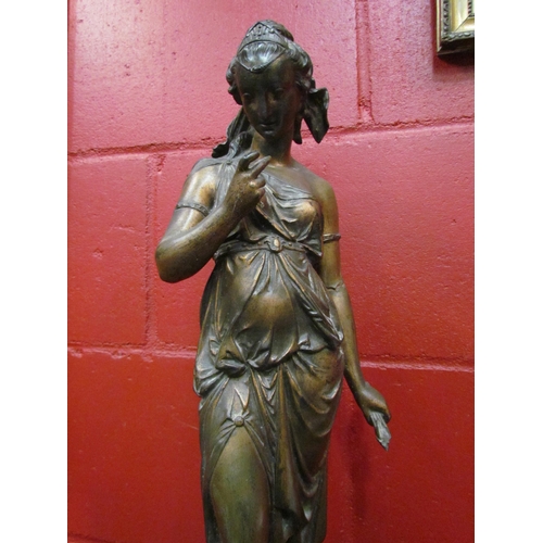 4116 - A bronzed spelter figure of a female in drapery holding arrows, 58cm tall