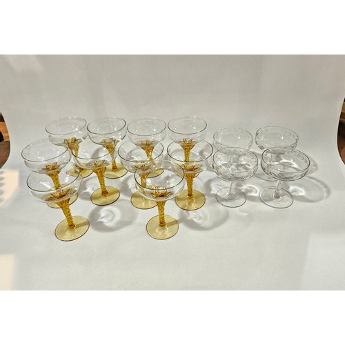 4098 - Ten champagne saucers with amber stems and four clear glass saucers