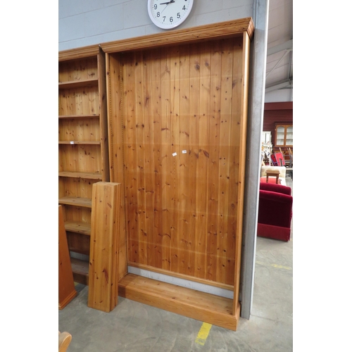 2294 - A large country pine bookcase, plinth base   (E)  £15-30