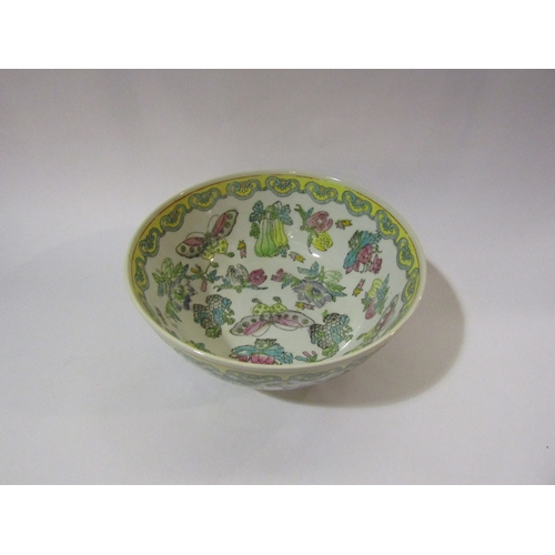 4236 - A 20th Century Oriental style footed bowl painted in enamels depicting butterflies, fruit and flower... 