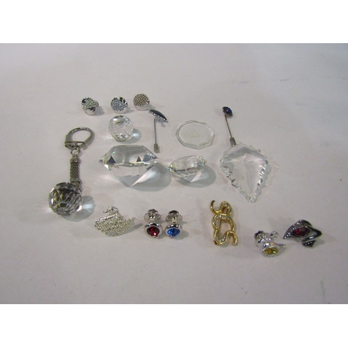 4374 - A collection of small Swarovski pieces; brooch, keyring, etc