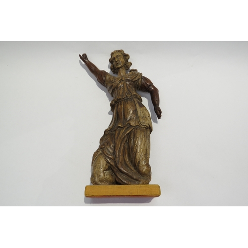 4367 - A 17th Century carved fruit wood female figure with hand aloft, elements maybe missing from back, wo... 