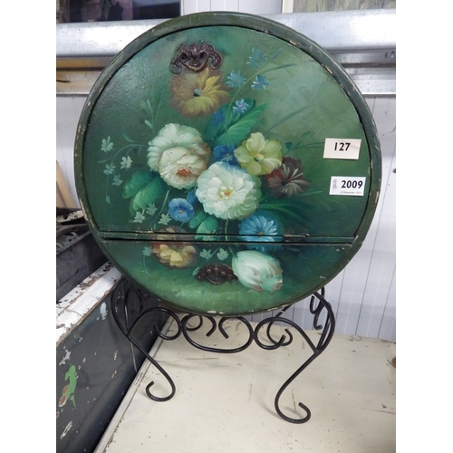 2009 - A small painted cabinet on wrought metal base and a painted tin wall hanging plate