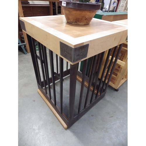 2046 - A maple butchers block on square iron slatted stand on oak feet 65cm sq