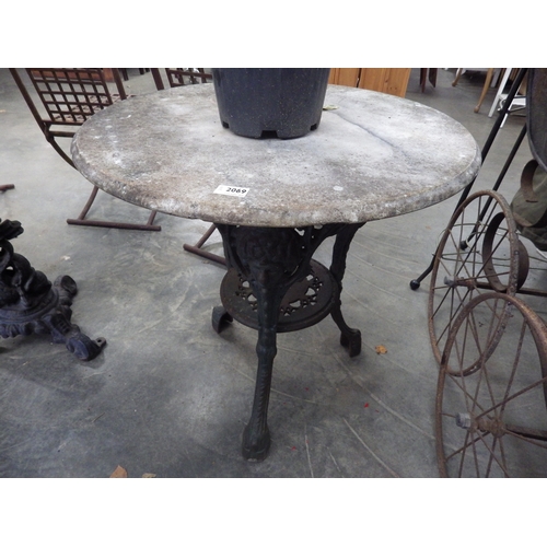 2069 - A cast iron based marble top pub table   (R)  £60