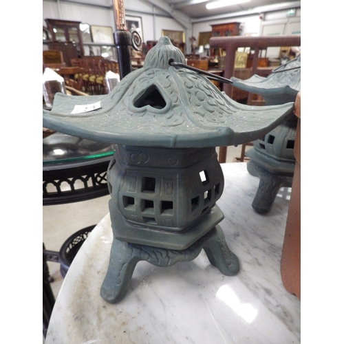 2073 - A pair of cast alloy chinese pagoda lanterns