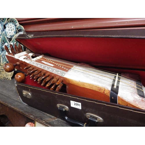 2091 - An Indian Bina cased instrument