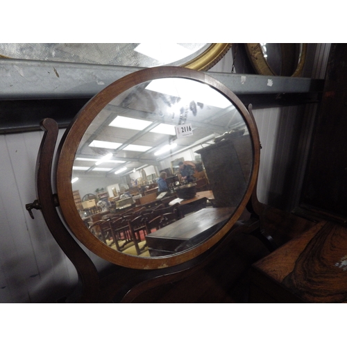 2116 - A mahogany oval dressing table mirror