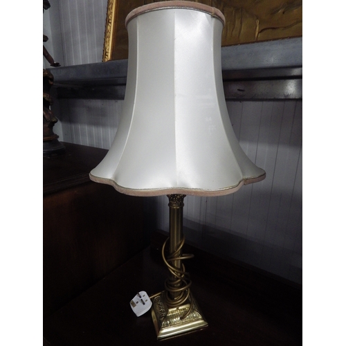 2140 - A figural lamp with Tiffany shade and a brass lamp