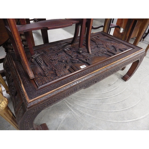 2152 - An oriental heavily carved oak coffee table