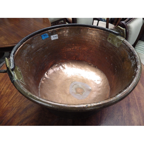 2163 - A large French hammered copper cauldron pot, iron handle