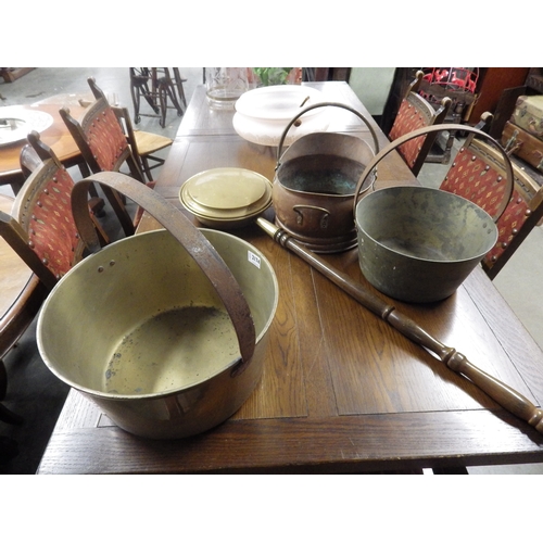 2174 - Two brass jam pans, coal helmet and a bed pan