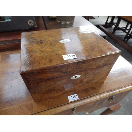 2179 - A Victorian walnut writing box with glass bottles to interior