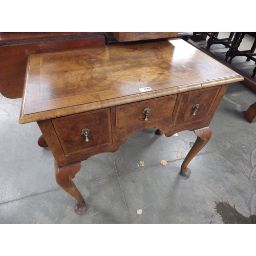 2180 - A Queen Anne style walnut low boy with three drawers, chip to back foot