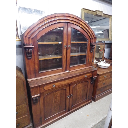 2213 - A Victorian mahogany and glazed dome top cabinet on cupboard