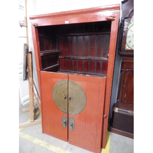 2299 - A red lacquered Chinese cabinet, the door hinge mounts a/f