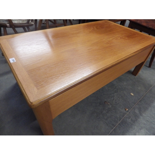 2309 - A Nathan teak coffee table with a smooth lift top motion revealing a fitted interior   (E)  £20-30