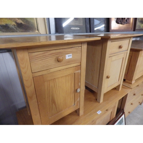 2332 - A pair of modern light oak one drawer over one door bedside cabinets