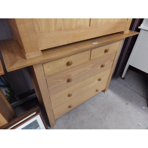 2334 - A modern light oak two over three chest of drawers