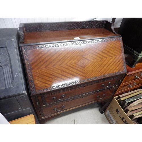 2350 - An Edwardian mahogany fret carved bureau