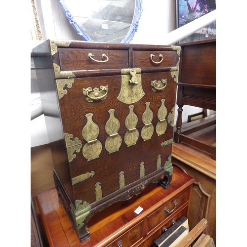 2352 - A Chinese two drawer over one door cabinet with brass handles and decoration