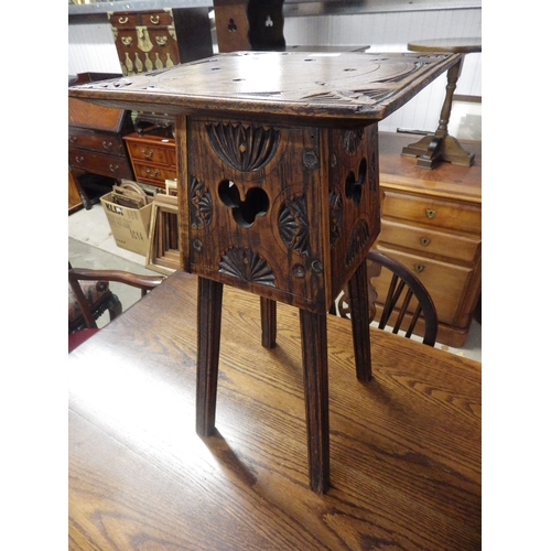 2364 - A carved oak occasional table