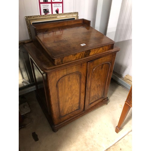 2099 - A Victorian walnut cupboard with writting slope top