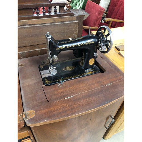 2412 - A 1950's walnut cased sewing machine   (E)  £10-15